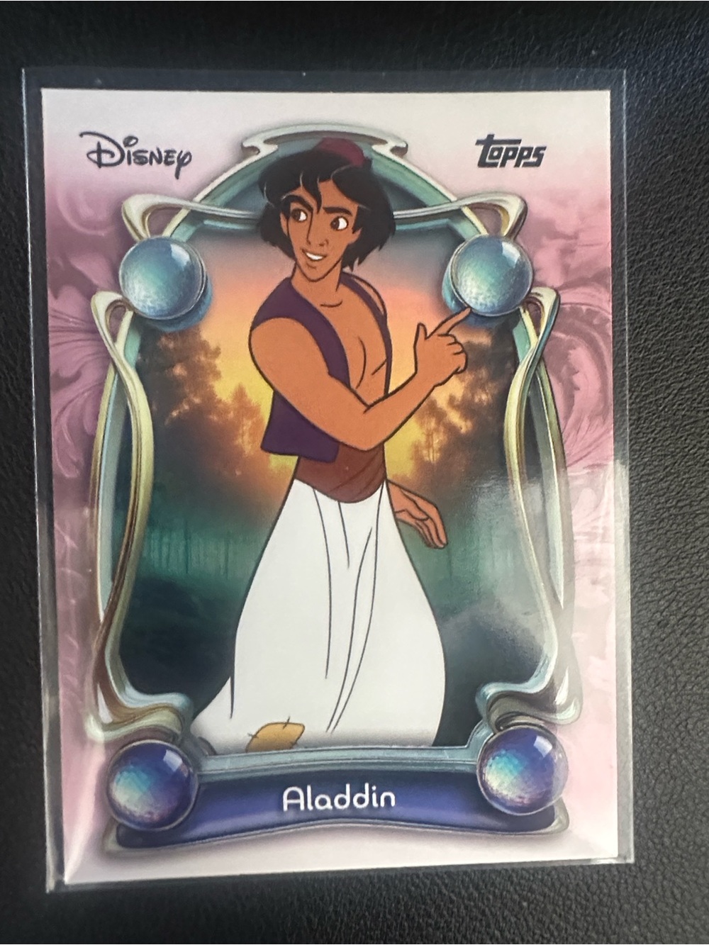 Aladdin card on black background